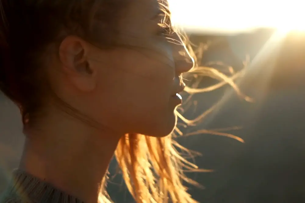 woman with floating hair in profile